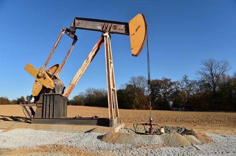 A pump jack sits atop an oil well drilled by Campbell Energy this fall behind the Super 8 hotel in Grayville.