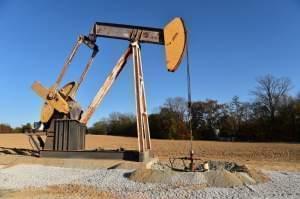 A pump jack sits atop an oil well drilled by Campbell Energy this fall behind the Super 8 hotel in Grayville.