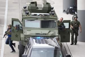 Law enforcement personnel arrive in an armored car outside Fort Lauderdale–Hollywood International Airport, Friday, Jan. 6, 2017, in Fort Lauderdale, Fla. A gunman opened fire in the baggage claim area at the airport Friday, killing several peo