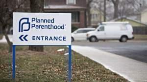 Signage is displayed outside a Planned Parenthood office in Peoria, Ill. Donald Trump's political inner circle is very much in favor of defunding the organization. 