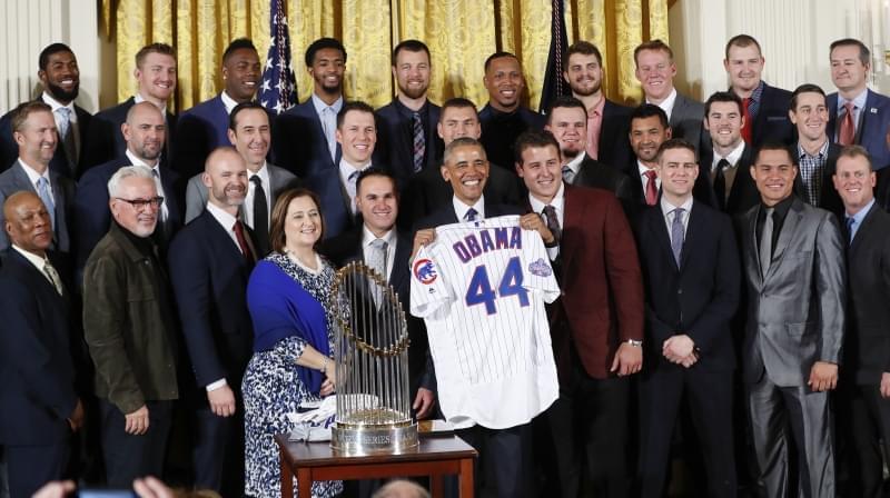 President Barack Obama holds up a personalized Chicago Cubs baseball jersey presented to him for a group photo during a ceremony in the East Room of the White House in Washington, Monday, where the president honored the 2016 World Series Champion bas