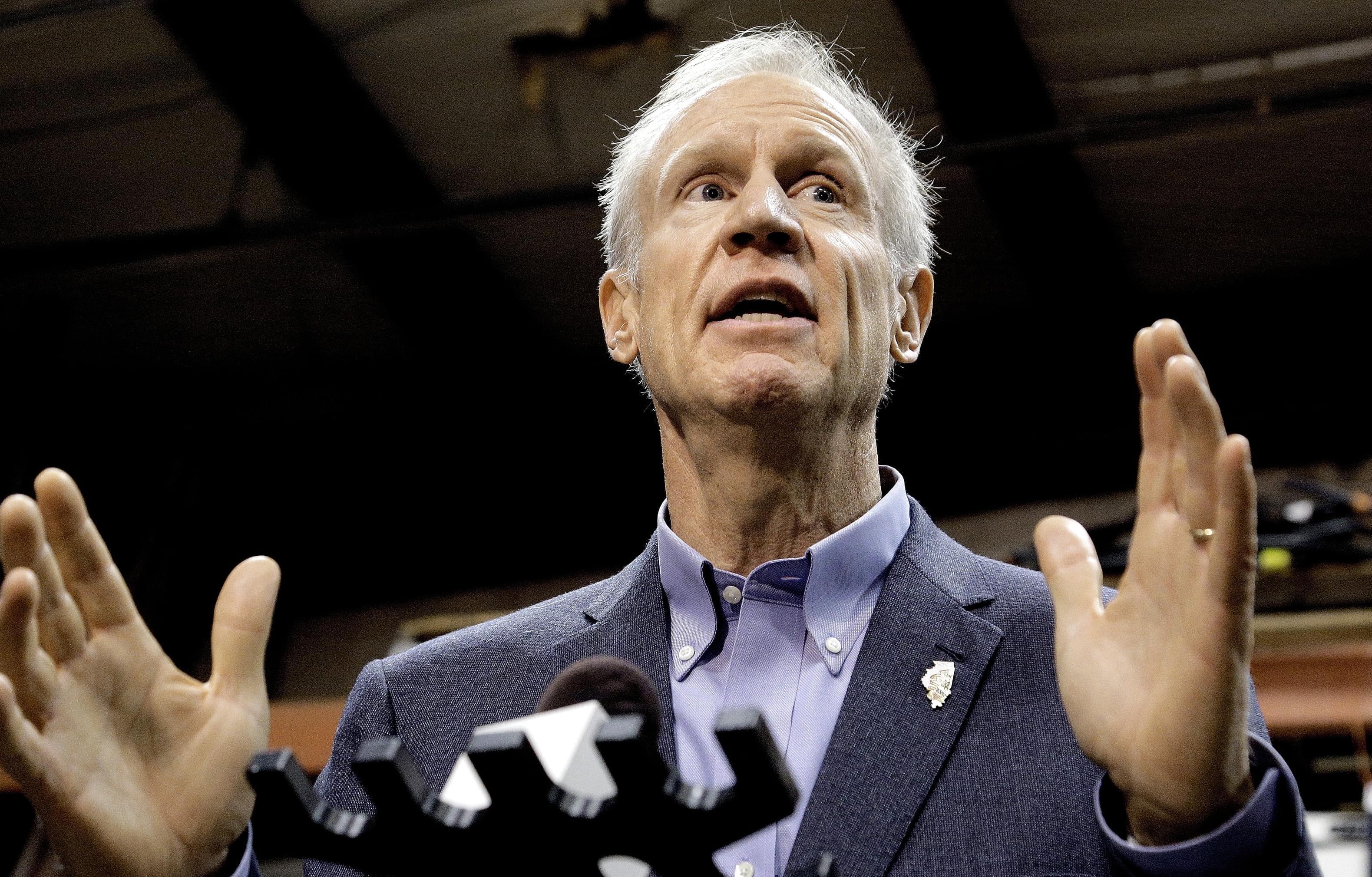 In this Wednesday, Nov. 16, 2016, file photo, Illinois Gov. Bruce Rauner speaks to reporters after meeting with legislative leaders during veto session in Springfield.