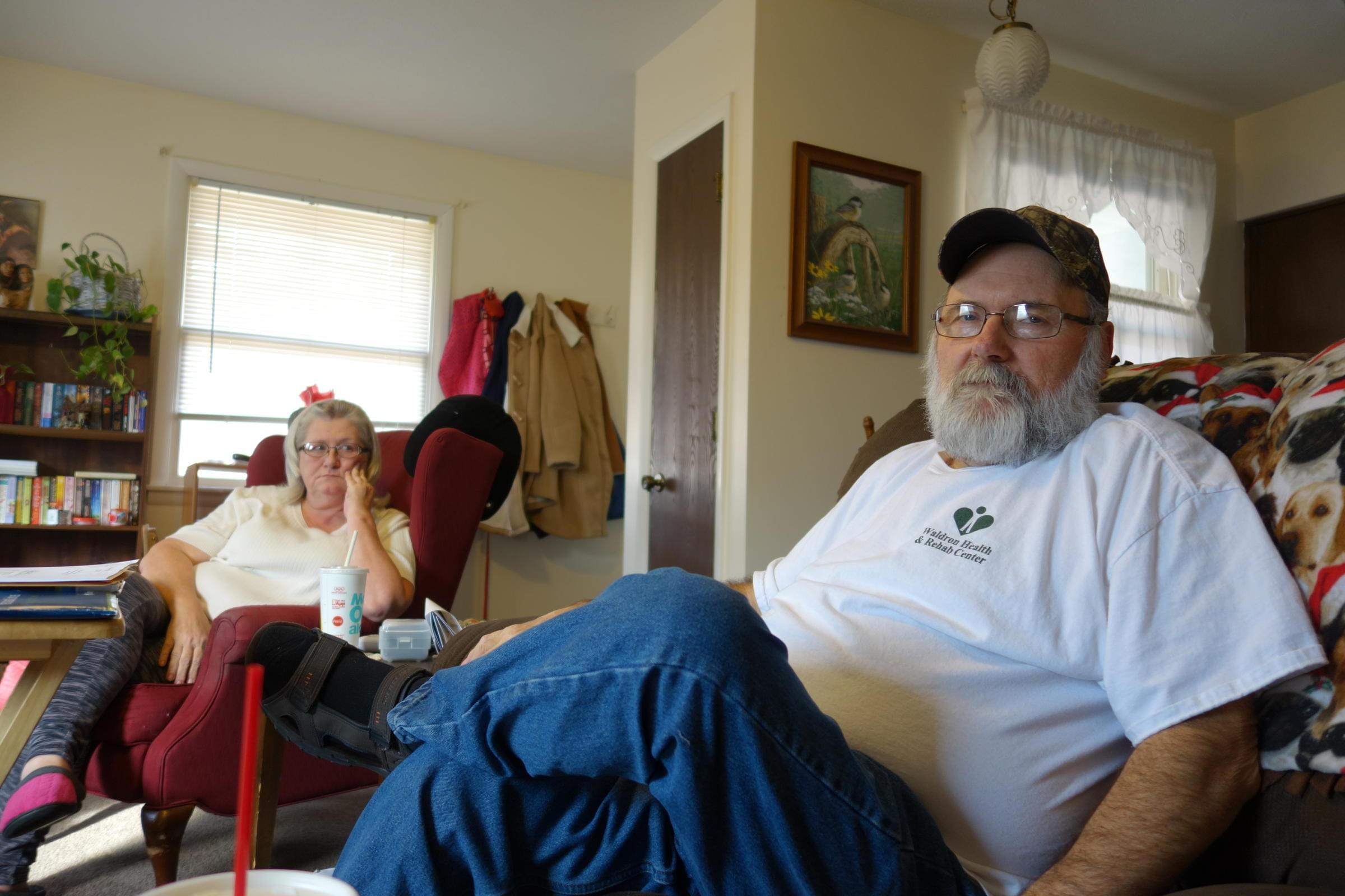 Allen Wilson sitting with his wife.