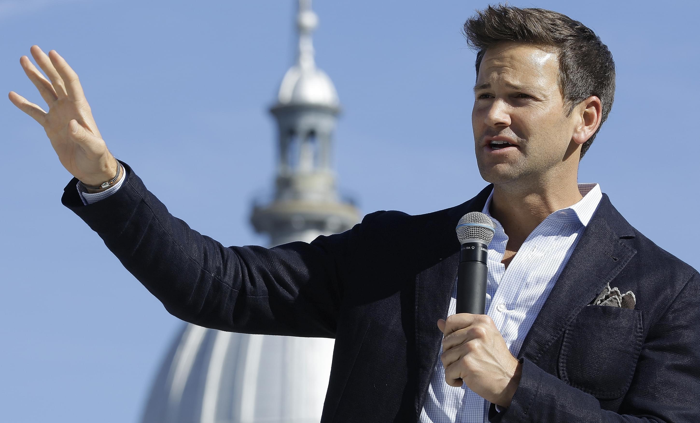 Former Congressman Aaron Schock, R-Ill., speaks in support of Bruce Rauner during a gubernatorial campaign rally outside the State Capitol in Springfield, Ill., Monday, Nov. 3, 2014.