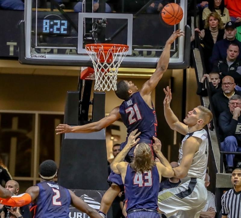 Illini Malcolm Hill rejects Purdue's Isaac Haas during the Boilermakers 91-68 win over Illinois.