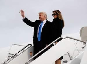 President-elect Donald Trump, accompanied by his wife Melania, waves as they arrive at Andrews Air Force Base, Md., Thursday, Jan. 19, 2017, in advance of Friday's inauguration.