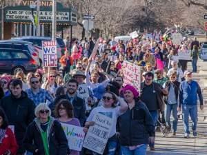 Participants in Saturday's Women's March in downtown Champaign make their way down Park Avenue. 