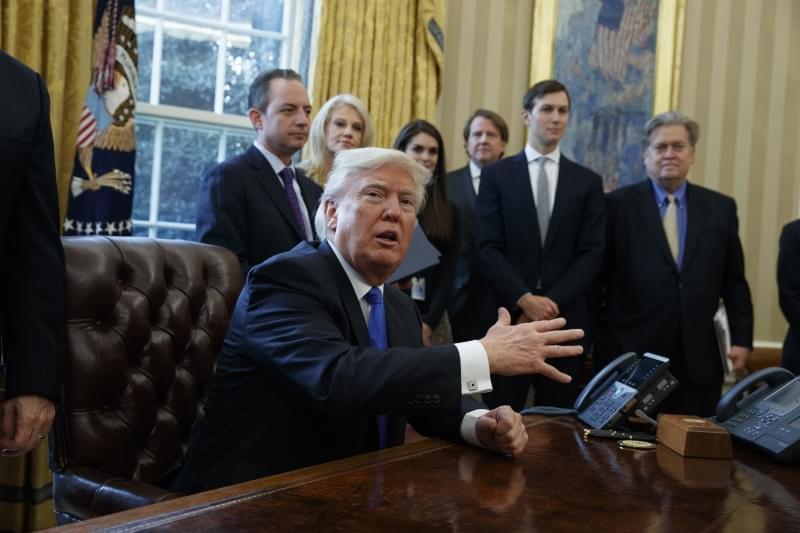 President Donald Trump talks with reporters n the Oval Office of the White House in Washington, Tuesday, Jan. 24, 2017, before signing an executive order on the Keystone XL pipeline