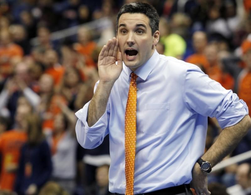 Former Illinois head coach Kevin Hambly yells to his players during an NCAA college semifinals volleyball match against USC, Thursday, Dec. 15, 2011, in San Antonio. 