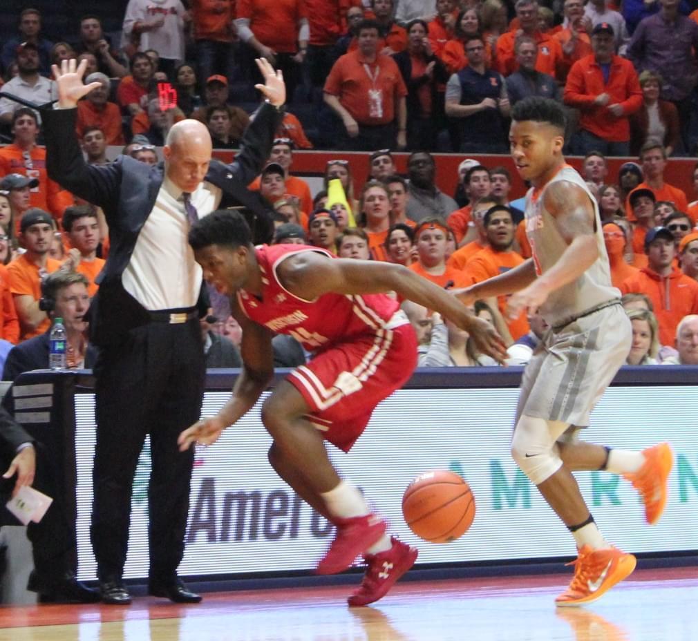 Illini coach John Groce avoids contact with Wisconsin's Nigel Hayes, Tuesday night in Champaign