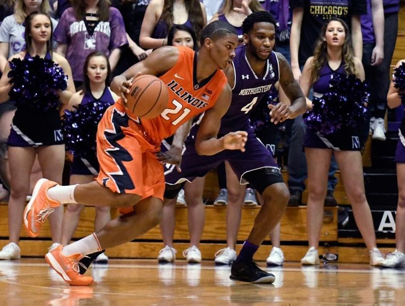 Illinois guard Malcolm Hill (21) is defended by Northwestern forward Vic Law (4) during the second half of an NCAA college basketball game Tuesday, Feb. 7, 2017, in Evanston, Ill. Illinois won 68-61.