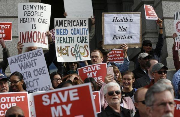 Supporters of the Affordable Care Act, who are also opponents of Colorado's GOP-led plan to undo Colorado's state-run insurance exchange, gather for a rally on the state Capitol steps in Denver, Tuesday, Jan. 31, 2017.