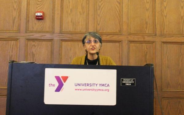U of I Urban and Regional Planning Professor Faranak Miraftab discusses her research of Beardstown at the University YMCA Friday. 