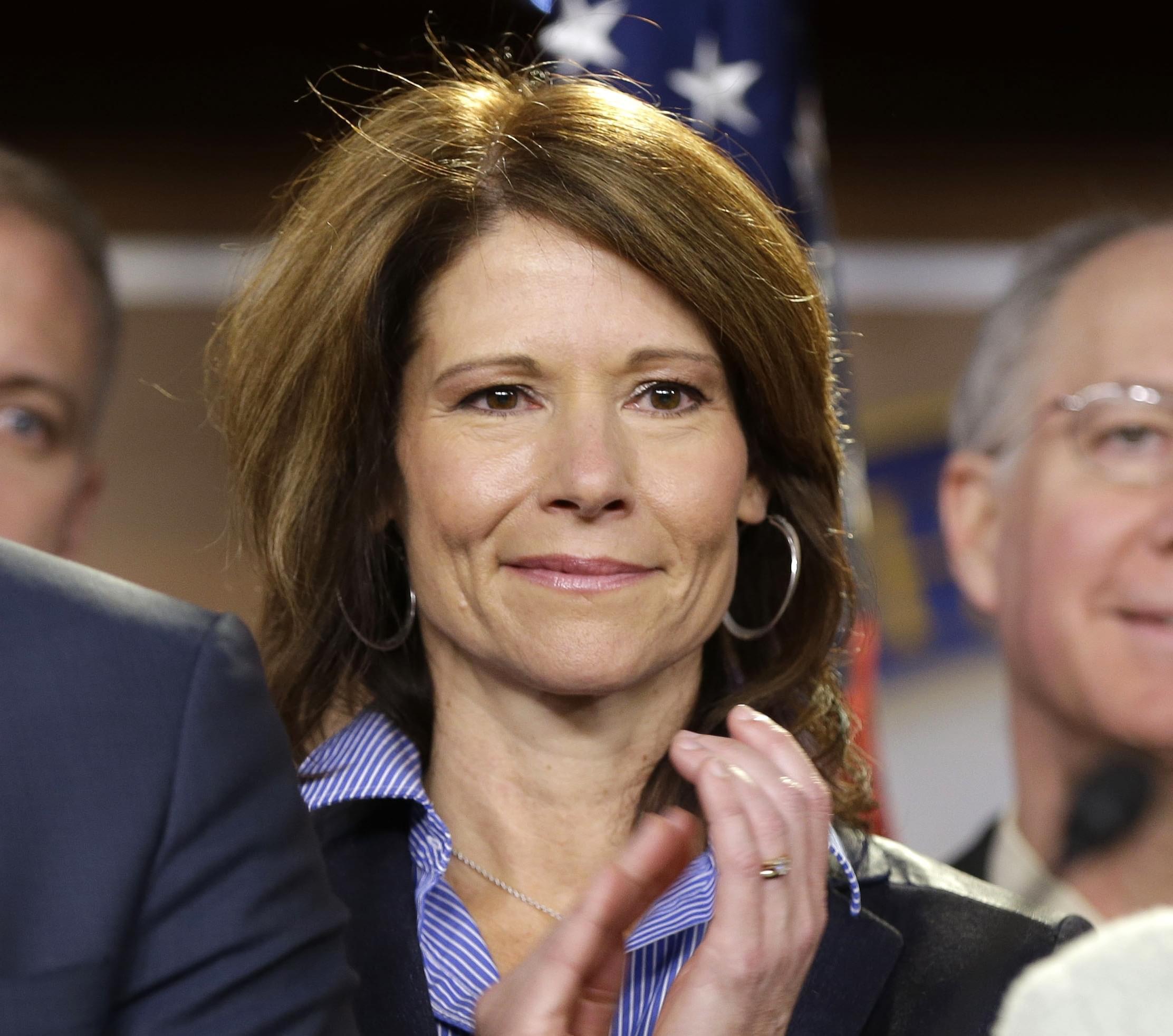 Rep.-elect Cheri Bustos D-Ill. is seen on stage during a news conference with newly elected Democratic House members, on Capitol Hill in Washington, Tuesday, Nov. 13, 2012. 