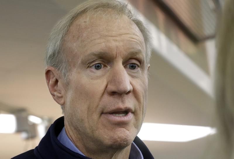 Illinois Gov. Bruce Rauner speaks to reporters after greeting veteran and participating in "Breakfast to Veterans for Veterans Day" Friday, Nov. 11, 2016, in Springfield.