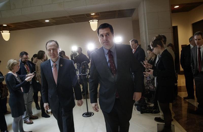 House Intelligence Committee Chairman Rep. Devin Nunes, R-Calif. (right), and the committee's ranking member Rep. Adam Schiff, D-Calif., depart after a briefing with FBI Director Jim Comey about Russian influence on the American presidential ele
