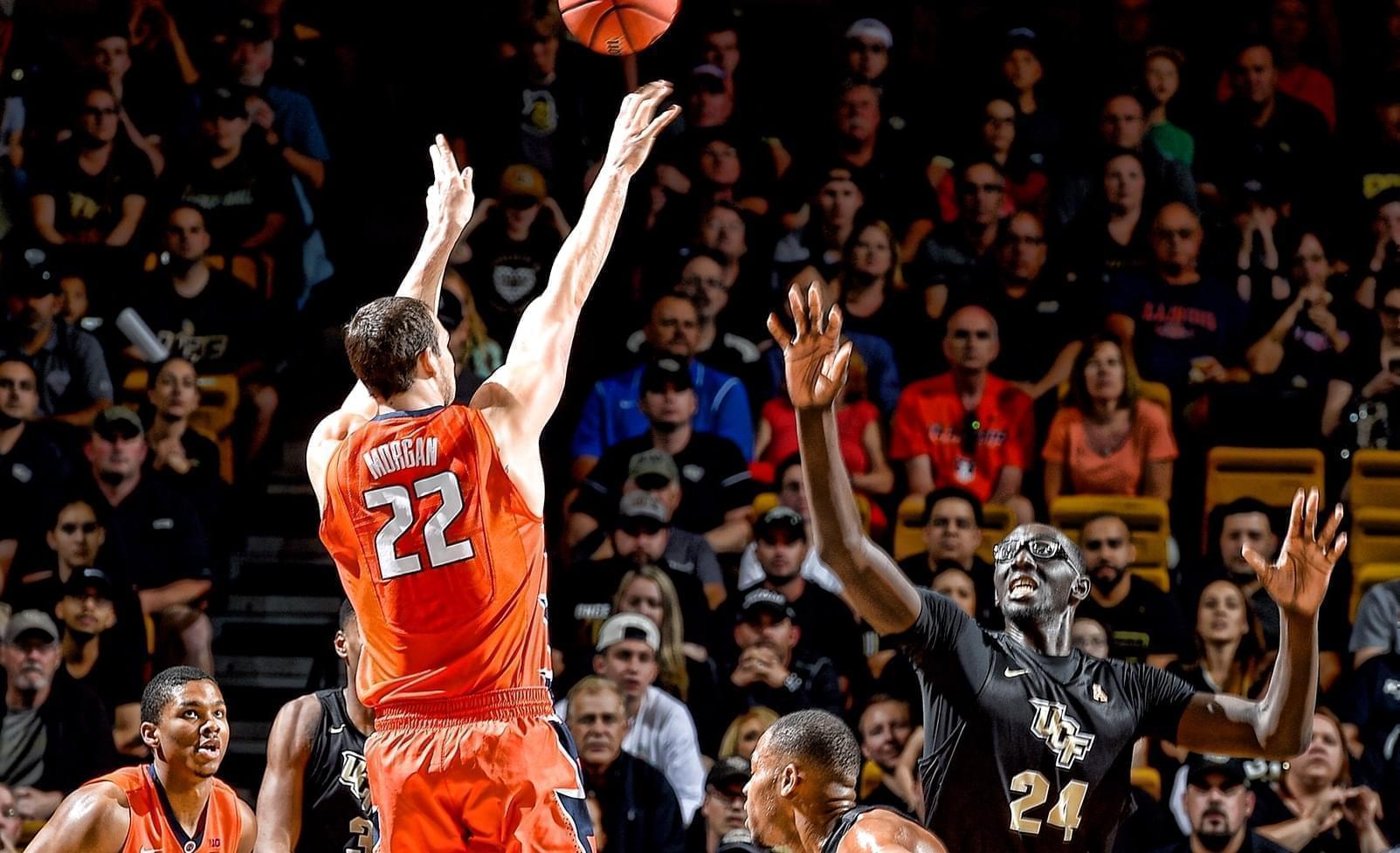Centers Maverick Morgan with the Illini and Tacko Fall of UCF compete for the ball during their Wednesday night NIT quarterfinal game in Orlando. 