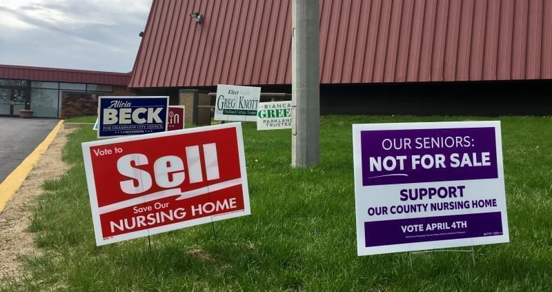 Signs promoting the two referenda regarding the Champaign County Nursing Home.