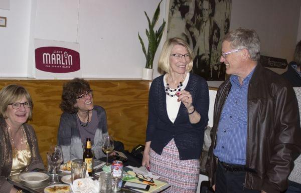 Diane Marlin celebrates her victory with supporters at Pizza M in Urbana.