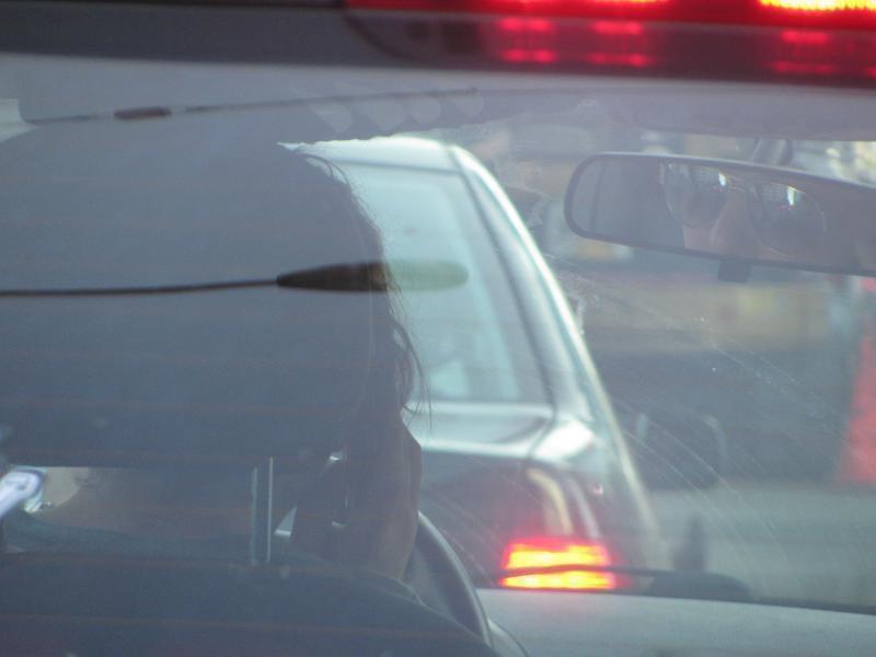 Woman talking on cell phone.