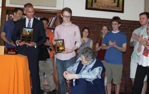 Sue Wood, center, is honored by volunteer chimes players and U of I Associate Provost Matthew Tomaszewski.