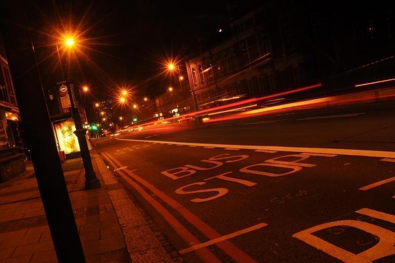 Bus stop at night.