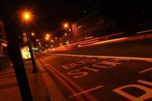 Bus stop at night.