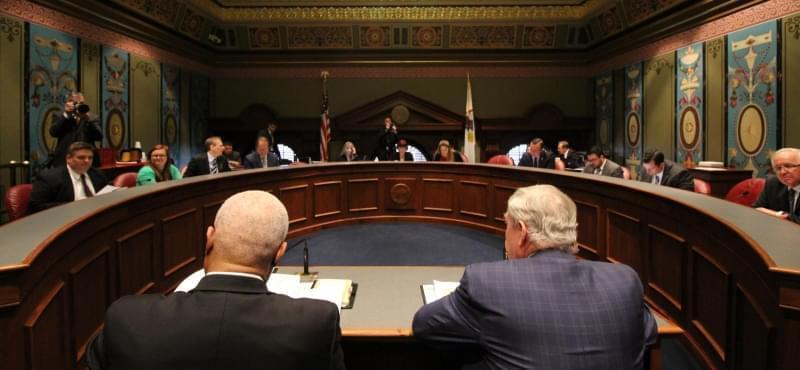 DCFS Director George Sheldon, foreground right, testifies Wednesday before the Senate Appropriations I Committee.
