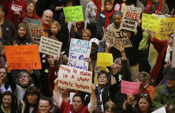 

Teachers rallied at the Statehouse in Indianapolis in 2011 to protest Gov. Mitch Daniels' attempts to curb collective bargaining, implement merit pay and create a voucher system that would send taxpayer money to private schools. 