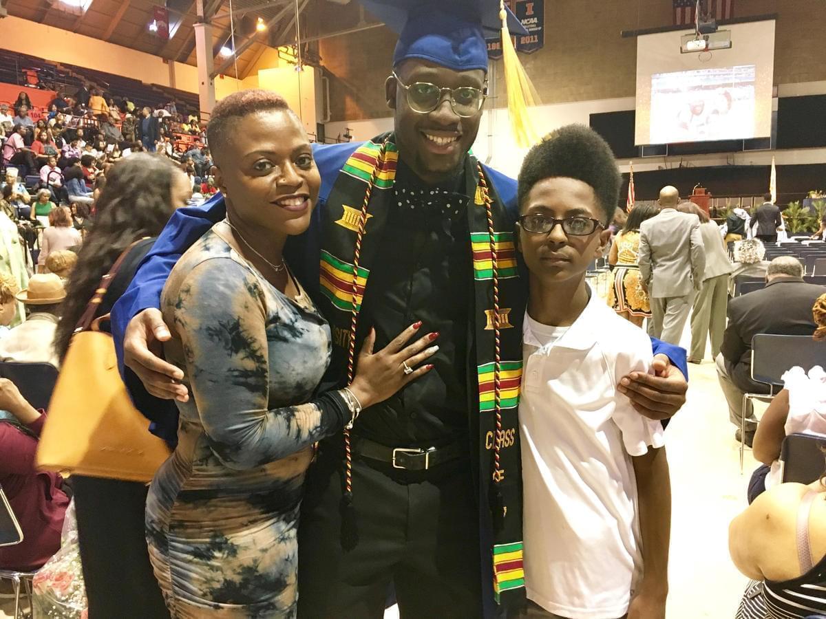 Dashawn Julion poses with his mother, Leisha Julion, and his 13-year-old brother Larry at the Black Congratulatory ceremony.