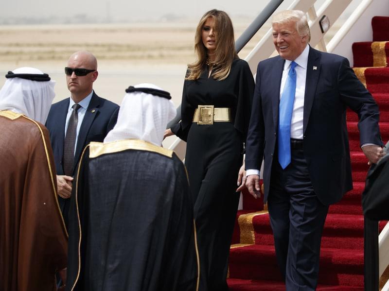 President Donald Trump, accompanied by first lady Melania Trump, smiles at Saudi King Salman, upon his arrival in Riyadh, Saudi Arabia.