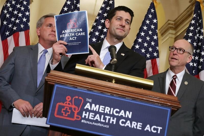 Speaker of the House Paul Ryan holds up a copy of the American Health Care Act during a March 7 news conference with House Majority Leader Kevin McCarthy, R-Calif. (left), and House Energy and Commerce Committee Chairman Greg Walden, R-Ore., outside 