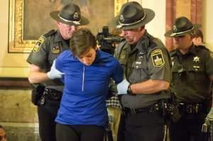 A protester being arrested at the Illinois state capitol on Tuesday evening