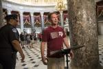 Rep. Rodney Davis, R-Ill., still wearing his baseball uniform, describes the scene on Capitol Hill in Washington, Wednesday.  