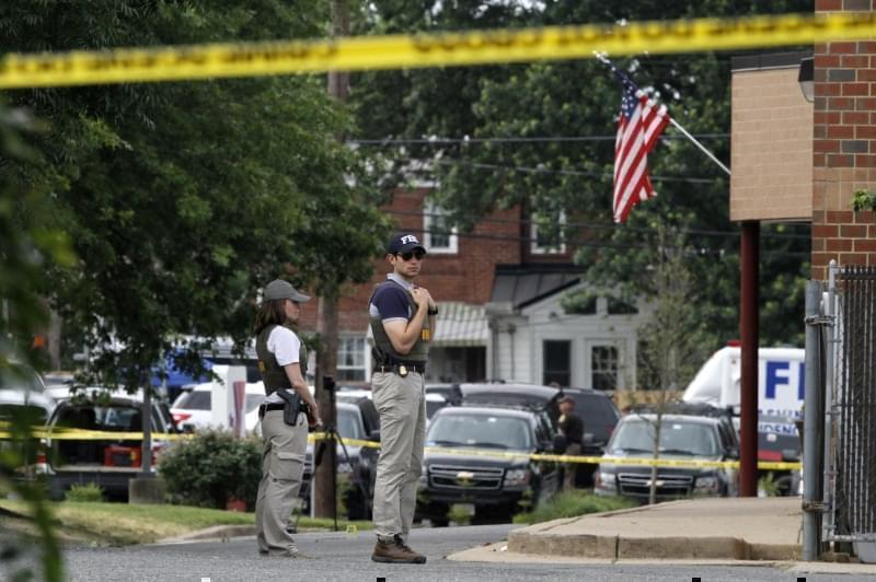 FBI agents at the scene of Wednesday's shooting at a Congressional Republican baseball practice in Alexandria, Va. 