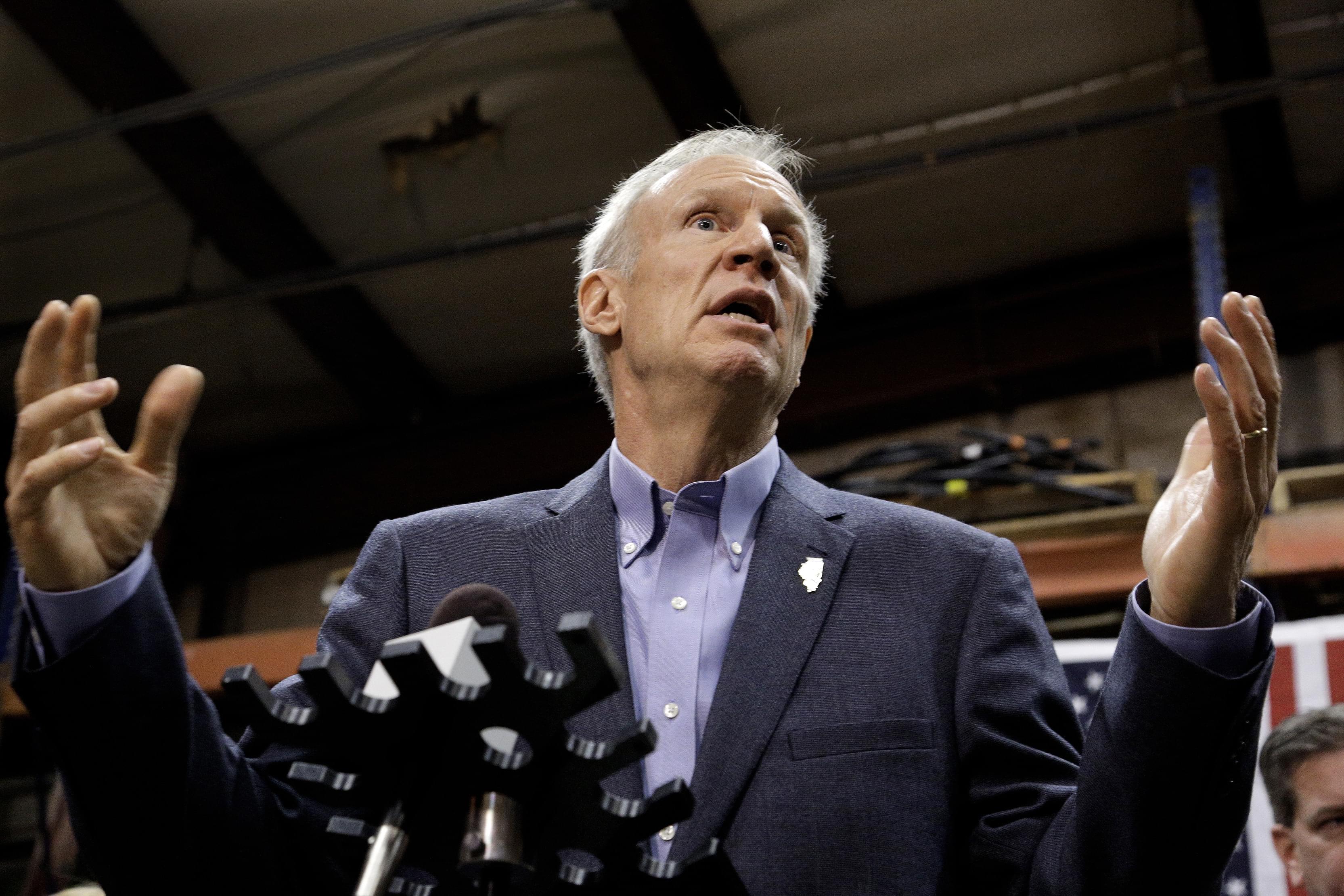 In this Wednesday, Nov. 16, 2016 photo, Illinois Gov. Bruce Rauner speaks to reporters after meeting with legislative leaders during veto session in Springfield, Ill.