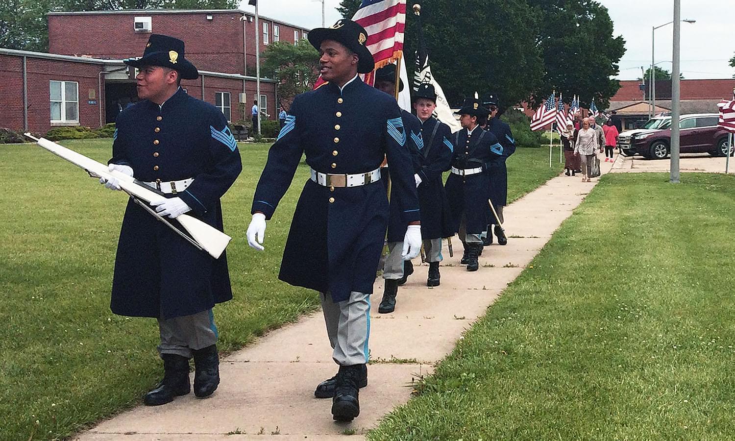 Lincoln's Challenge Academy cadets prepare for a Memorial Day ceremony last month at the school in Rantoul. The start of the next class will be delayed due to the state budget impasse.