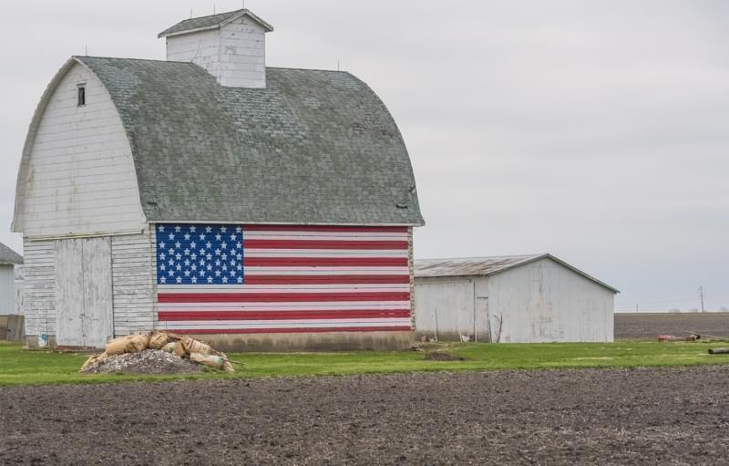 A barn with an American flag painted on the side sits on High Cross Road east of Urbana, Ill., in Champaign County.