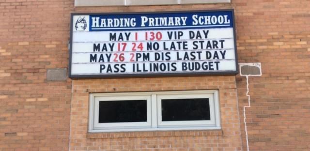 A marquee outside of Harding Primary School in Monmouth, IL. urges state lawmakers to pass a budget. 