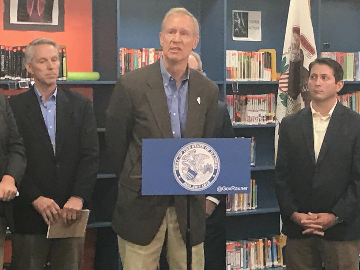 Gov. Bruce Rauner holds a press conference in Mt. Zion Junior High School to "demand" that Democrats send him their school funding plan so that he can veto parts of it.
