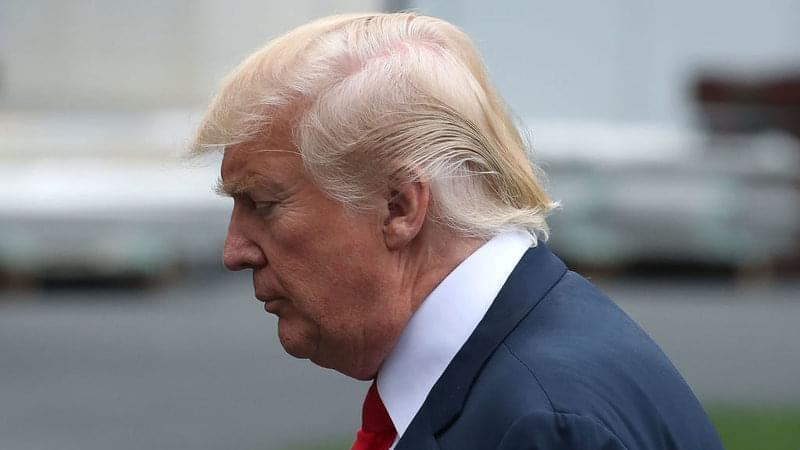 President Trump walks toward the White House after stepping off of Marine One on Monday morning.