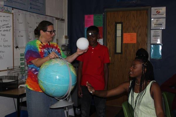 Kate Higgs, 8th grade science teacher at Franklin Middle School in Champaign, explains what will happen during Monday's solar eclipse.