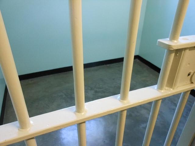 Photo of a jail cell.