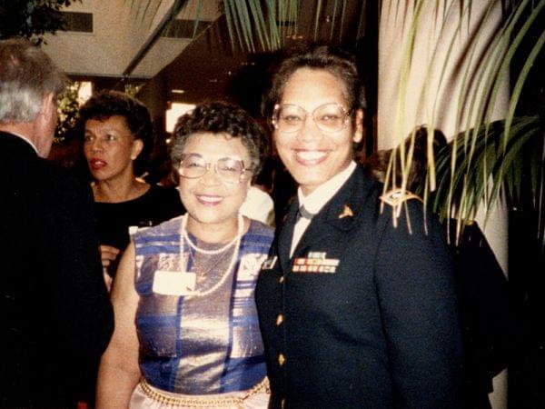 two women, Constance Edwards in uniform on the right