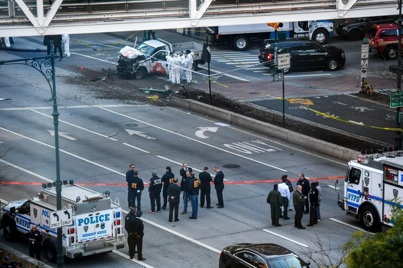 Investigators in New York City inspect a truck after a suspect plowed a vehicle into a bike and pedestrian path in Lower Manhattan and struck another vehicle on Tuesday, killing eight people and injuring at least 11 others.