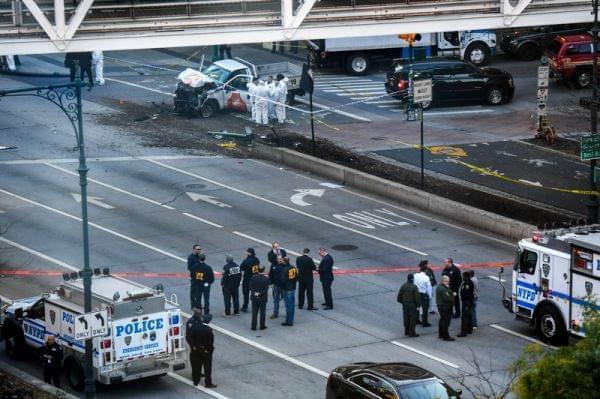 Investigators in New York City inspect a truck after a suspect plowed a vehicle into a bike and pedestrian path in Lower Manhattan and struck another vehicle on Tuesday, killing eight people and injuring at least 11 others. 
