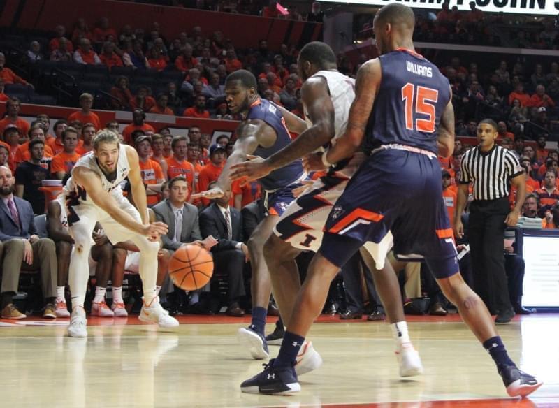 Michael Finke passes to teammate Leron Black in a 77-74 win over Tennessee-Martin.