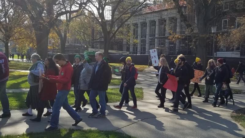 Members and supporters of AFSCME Locals 3700 & 678 demonstrate on the University of Illinois Urbana campus Main Quad Tuesday/