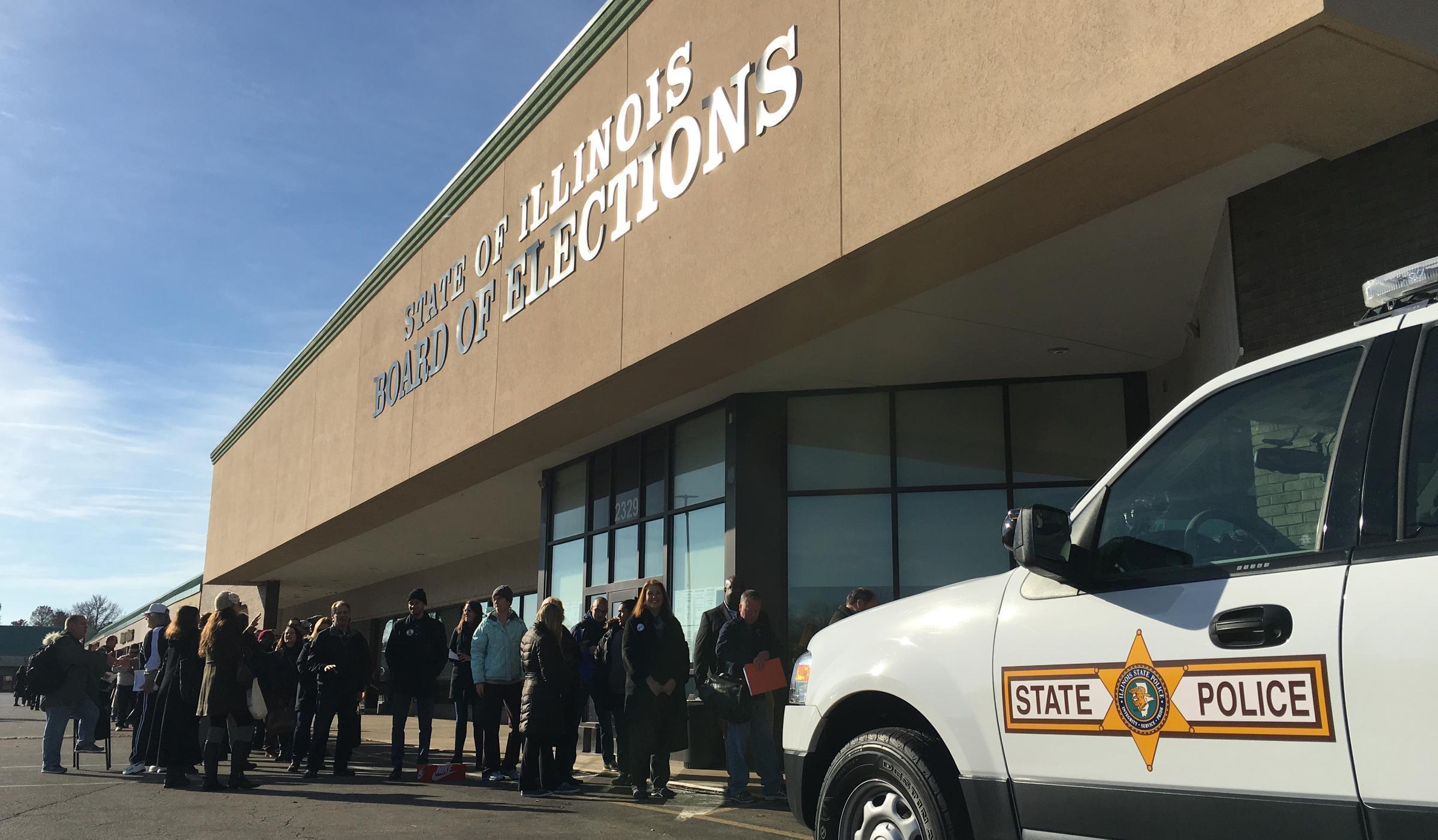 Candidates and campaign staff lined up before 8 a.m. Monday in order to have a chance at being listed first on the March 2018 primary election ballot.