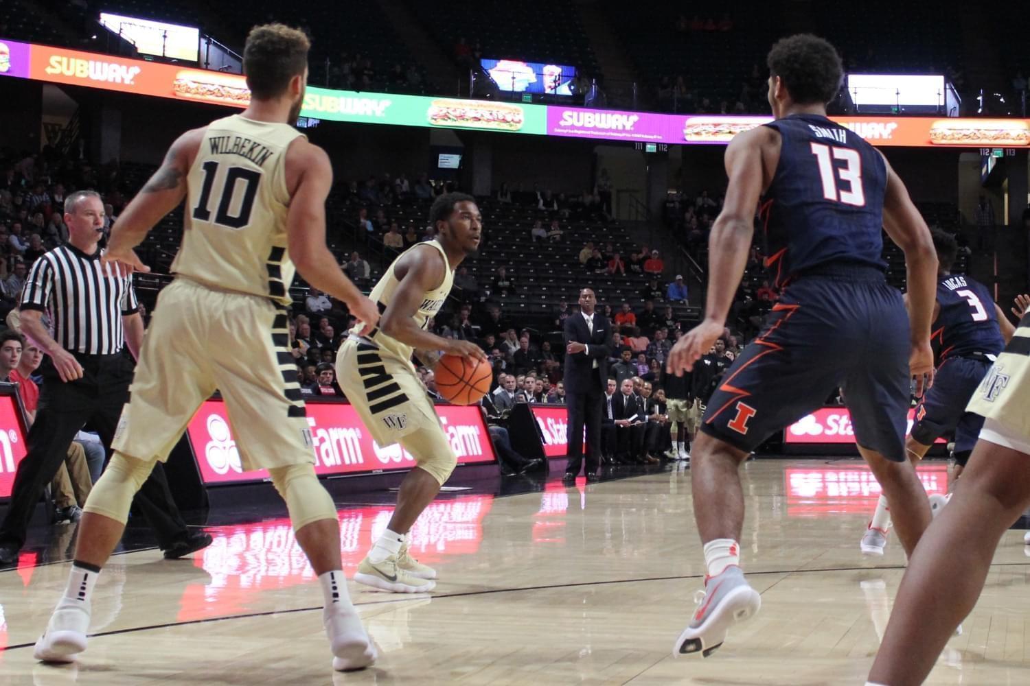 Wake Forest guard Bryant Crawford squares up for a three-pointer while Illini freshman Mark Smith defends in Illinois' 80-73 loss on Tuesday.